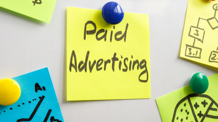 Image of a person using a laptop to research different lead generation tools